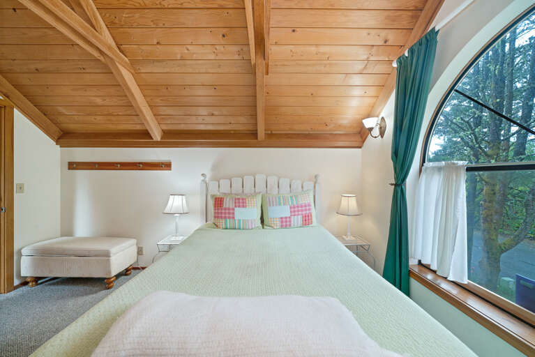 Upstairs queen bedroom with attached 1/2 bath