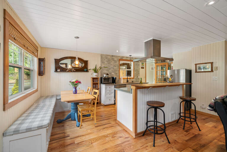 Fully equipped kitchen with Gas stove, Dishwasher, Microwave, Kuerig coffee maker, open to the living and dining area.