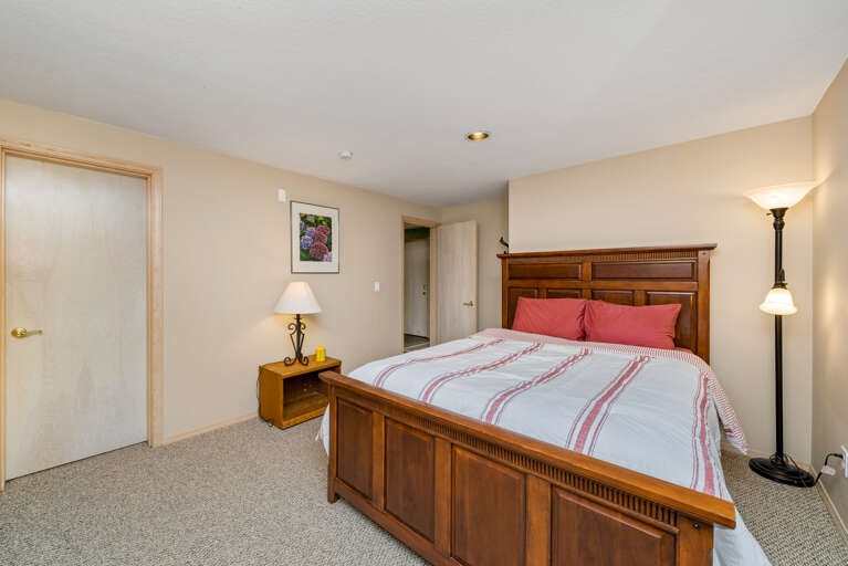 Downstairs Queen bedroom with Streaming TV, DVD, walk in closet