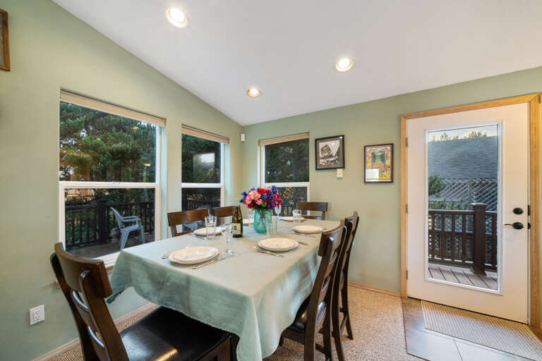 Dining area with seating for 6 plus breakfast bar for 2. Access to wrap around deck. 