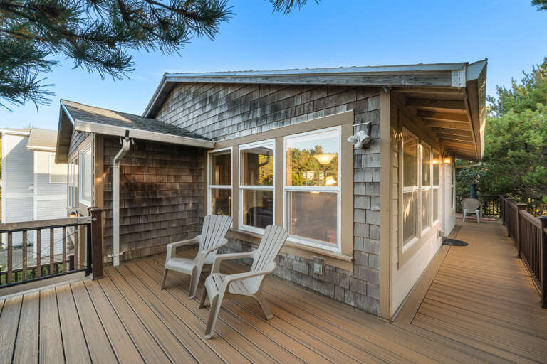 Front facing side of wrap around deck with outdoor furniture