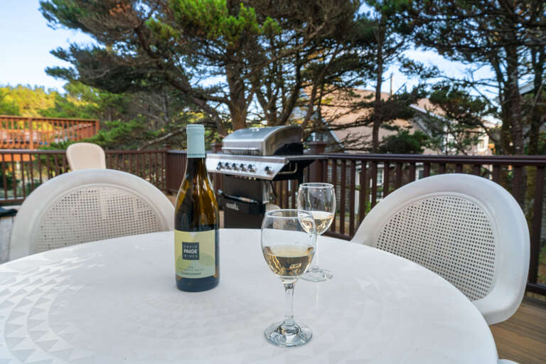 Wrap around deck with Gas BBQ, outdoor furniture, outdoor fireplace, and Adirondack chairs