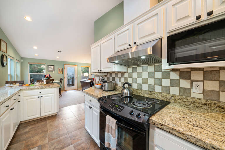 Large kitchen with breakfast bar and All new appliances coming soon.