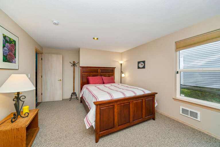 Downstairs Queen bedroom with Streaming TV, DVD, walk in closet