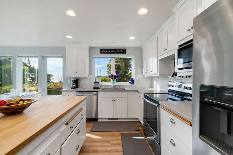 Fully equipped kitchen with Ocean views, breakfast bar and open to living and dining room.