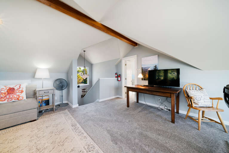 Third floor family room with Oceanview, work desk and TV