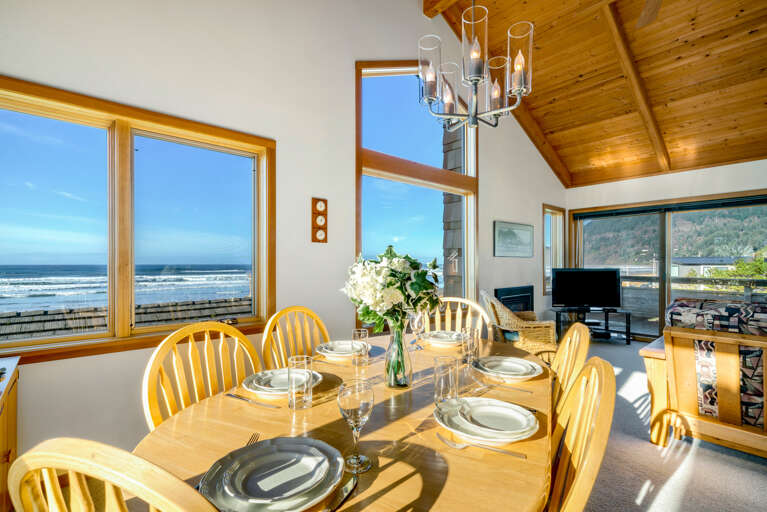 Dining room with seating for 6, ocean views and mountain views.