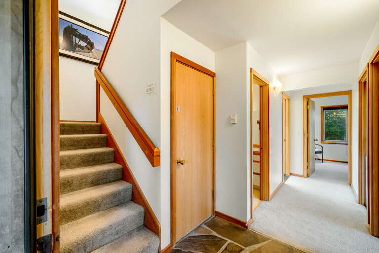 Entry area with stairs to upper living space and master bedroom. Lower level with 2 bedrooms, sunroom and laundry. 