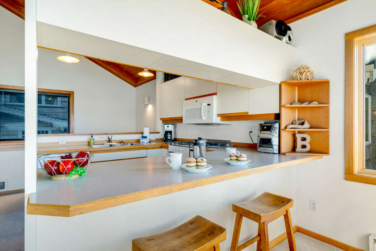 Gorgeous views from the fully equipped kitchen with a breakfast bar. 