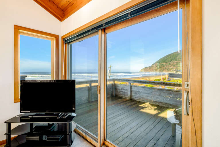 Living area with gas fireplace, Streaming TV, ocean and mounting views from all sides, Ocean view deck.  Open to the dining room that seats 6. 