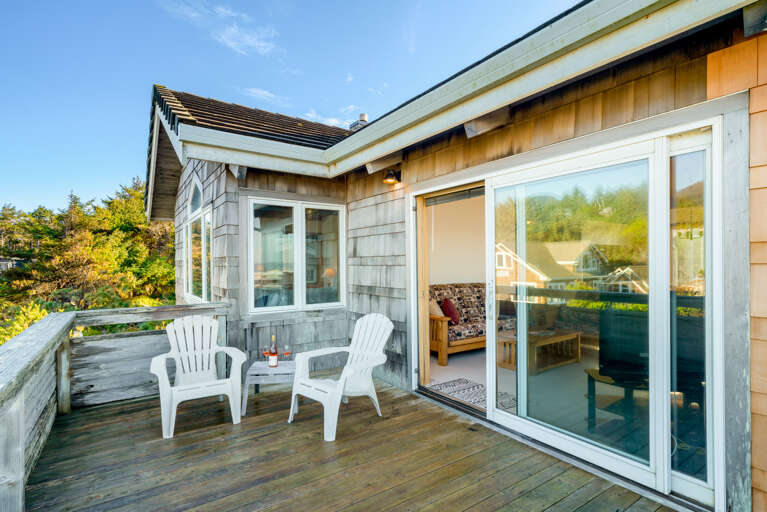 Living room deck with ocean and mountain views