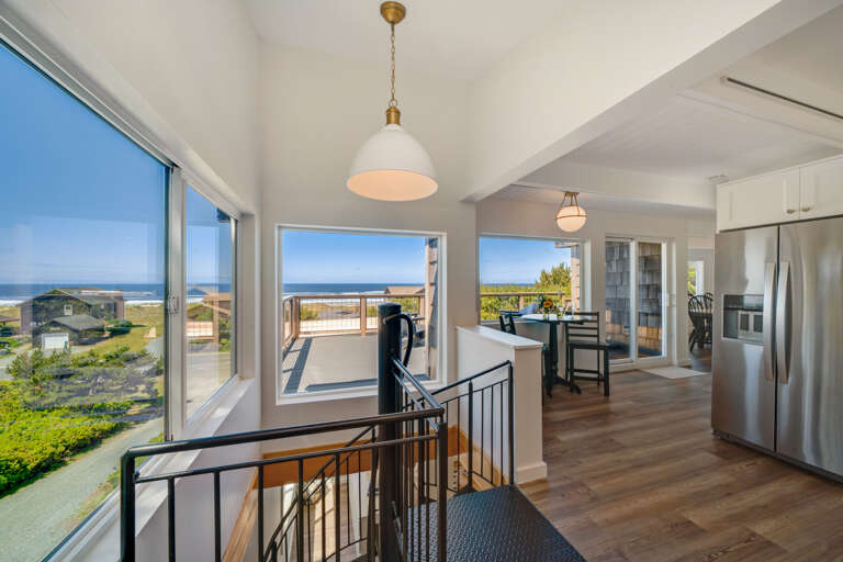 Spiral staircase from 1st to 2nd floor and view from kitchen 