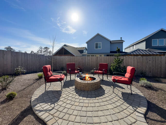 Backyard Patio with built in Firepit, Outdoor furniture, Gas BBQ, Covered patio area. 