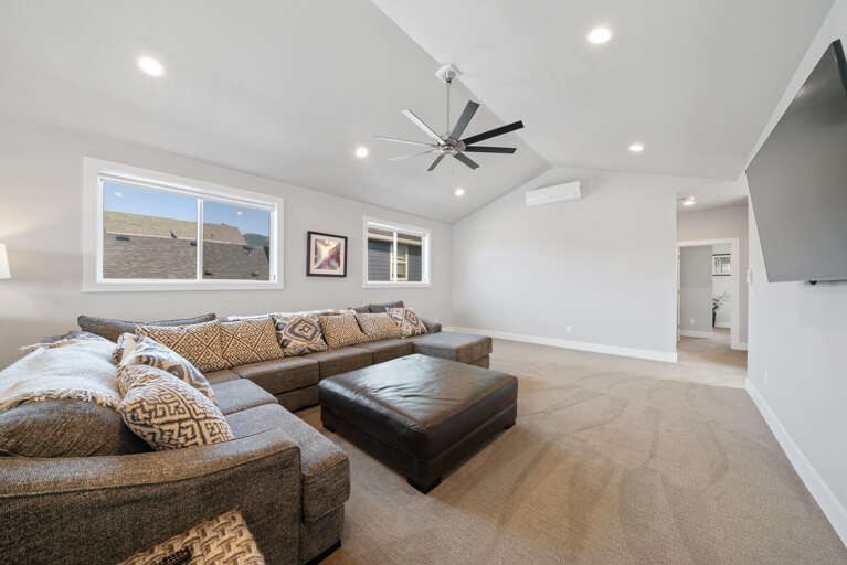 Spacious living area with TV on second floor