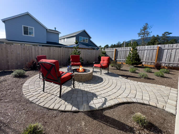 Backyard Patio with built in Firepit, Outdoor furniture, Gas BBQ, Covered patio area. 