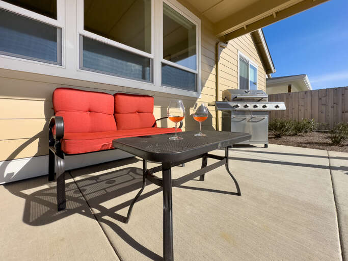 Backyard Patio with built in Firepit, Outdoor furniture, Gas BBQ, Covered patio area. 