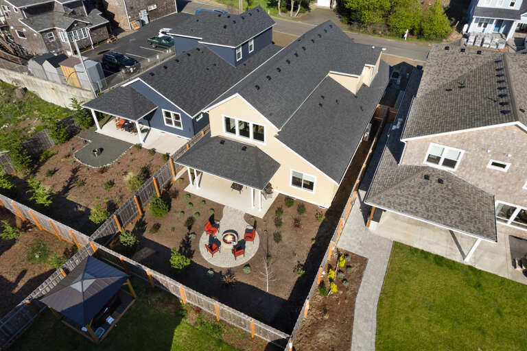 Backyard Patio with built in Firepit, Outdoor furniture, Gas BBQ, Covered patio area. 