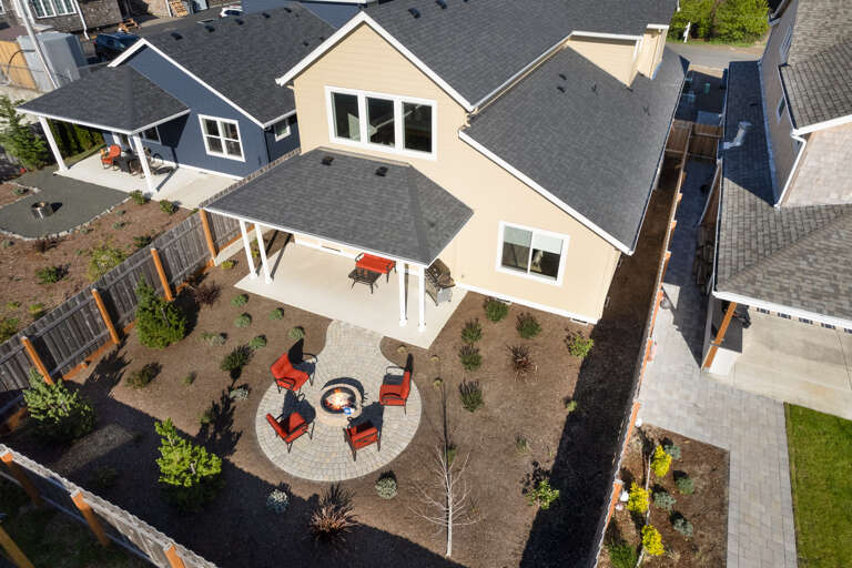 Backyard Patio with built in Firepit, Outdoor furniture, Gas BBQ, Covered patio area. 