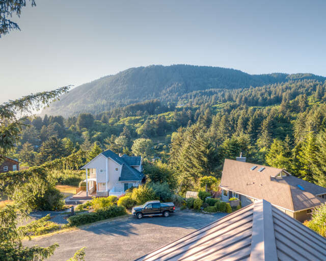 Decks with picnic table and distant ocean/mountain views.  Decks with picnic table and distant ocean/mountain views.