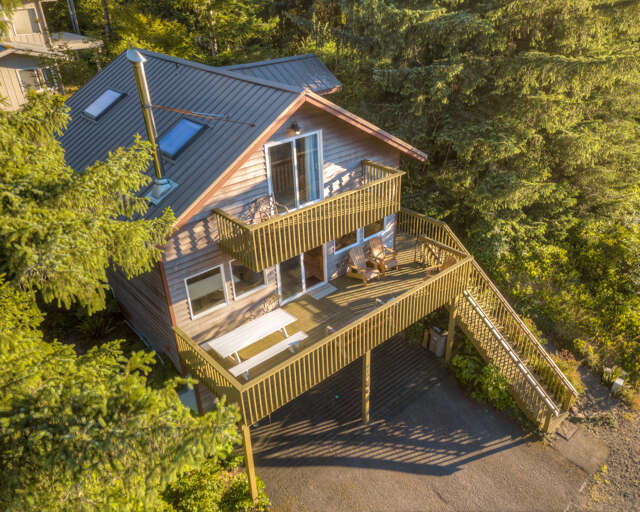 Decks with picnic table and distant ocean/mountain views.  Decks with picnic table and distant ocean/mountain views.