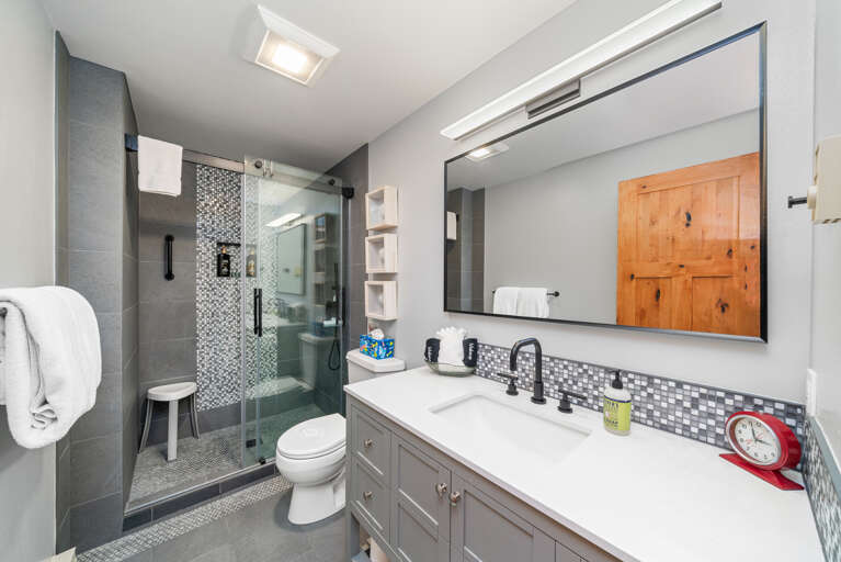 Newly remodeled downstairs bathroom with walk in shower.  Newly remodeled downstairs bathroom with walk in shower.