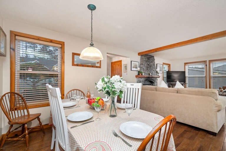 Dining room table seats 6, open to living room and kitchen with breakfast bar with seating for 4 Dining room table seats 6, open to living room and kitchen with breakfast bar with seating for 4