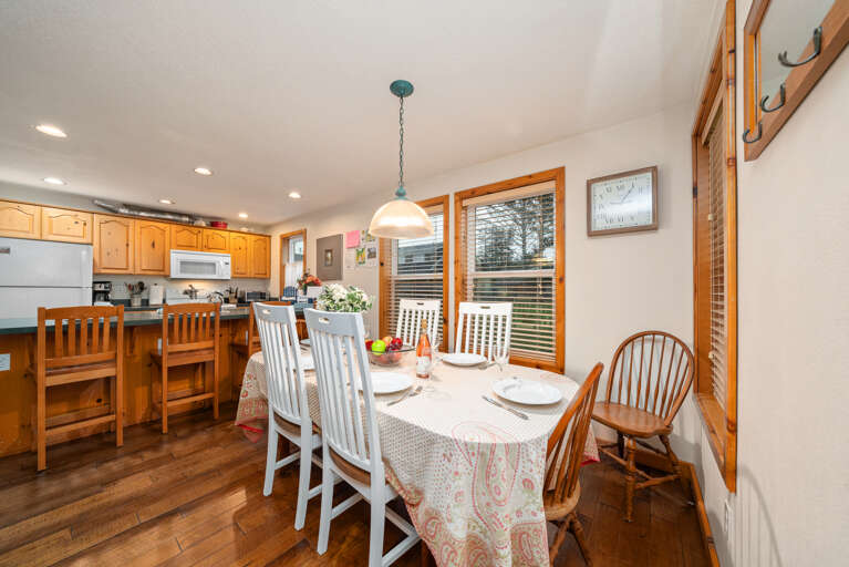 Dining room table seats 6, open to living room and kitchen with breakfast bar with seating for 4 Dining room table seats 6, open to living room and kitchen with breakfast bar with seating for 4