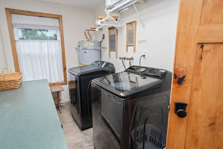 Laundry room on main floor with access to back deck.  Laundry room on main floor with access to back deck.