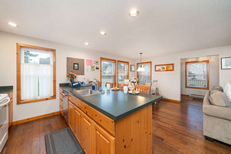 Fully equipped kitchen with breakfast bar, open to living room and dining room . Fully equipped kitchen with breakfast bar, open to living room and dining room .