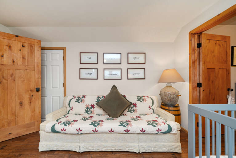 Bunk room with cozy couch, set of bunks, 2 twin beds, and crib.  Bunk room with cozy couch, set of bunks, 2 twin beds, and crib.