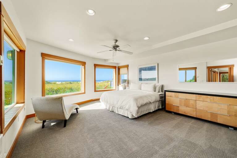 King Bedroom with an inviting chaise perfect for watching the sunrise or sunset.