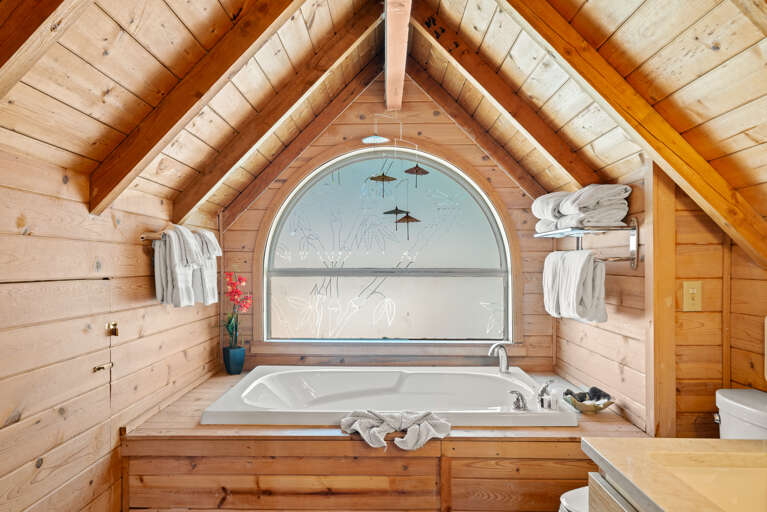 Soaker tub in loft on upper floor