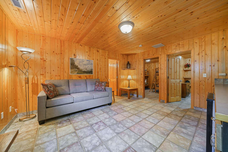 Downstairs den with cable tv, mini fridge, microwave and queen sofa bed. 