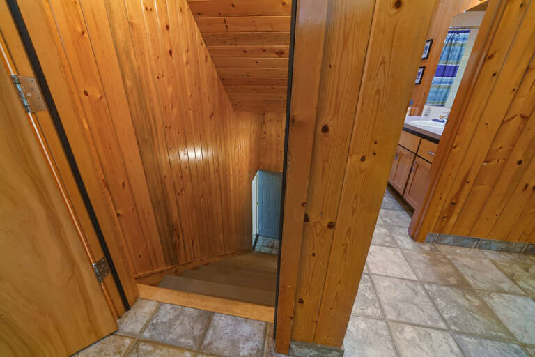 Stairs to downstairs bedrooms and den