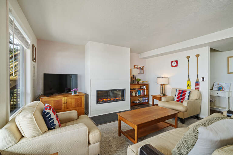 Living room with Streaming TV, electric fireplace, amazing ocean views.