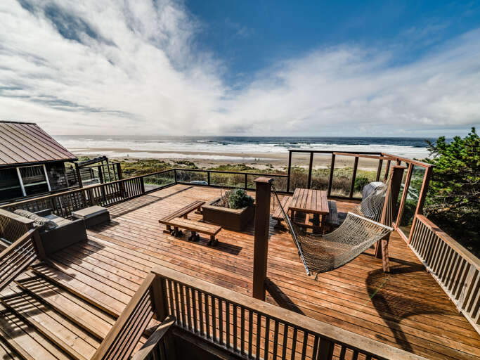 DUPLEX unit. Renters have the lower unit and access to the deck.  Directly across the street from the beach. Garage not accessible.