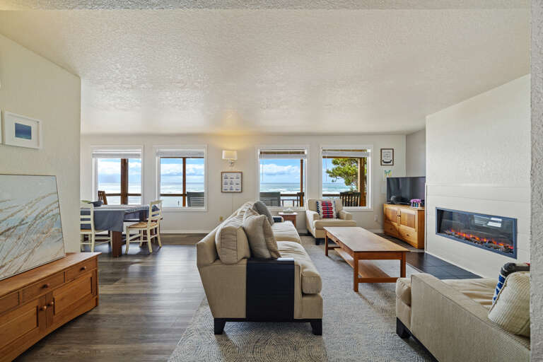 Living room with Streaming TV, electric fireplace, amazing ocean views.