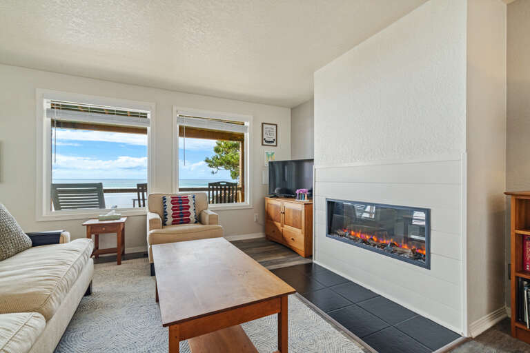Living room with Streaming TV, electric fireplace, amazing ocean views.