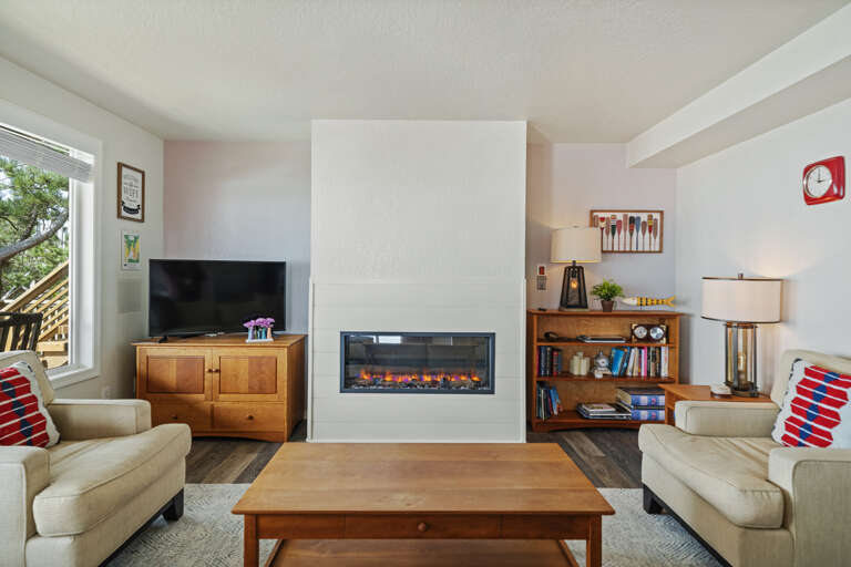 Living room with Streaming TV, electric fireplace, amazing ocean views.