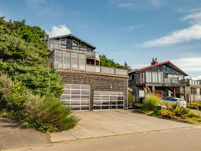 DUPLEX unit. Renters have the lower unit and access to the deck.  Directly across the street from the beach. Garage not accessible.