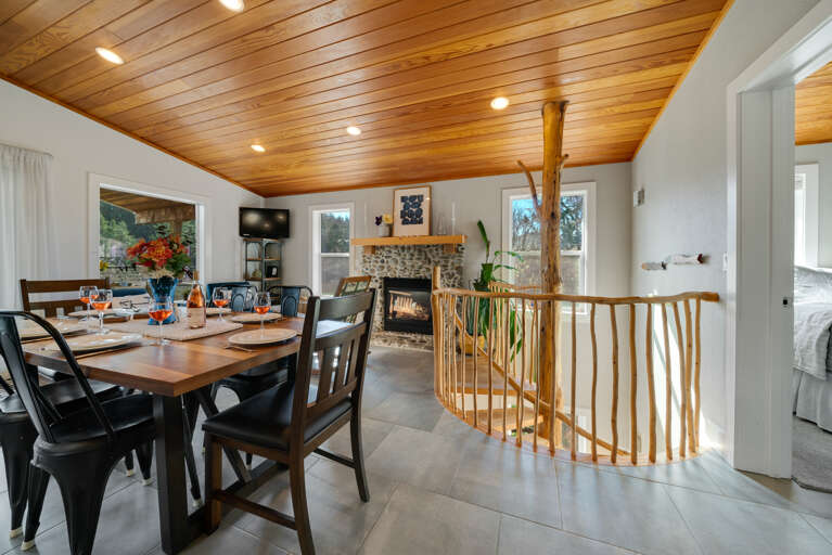 Open Floor plan with Dining table for 6 plus Bar seating. Open to the Living room with Streaming TV, Gas Fireplace, Access to upper deck.  Open Floor plan with Dining table for 6 plus Bar seating. Open to the Living room with Streaming TV, Gas Fireplace, Access to upper deck.