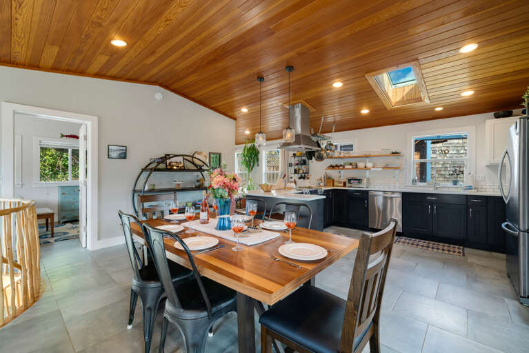 Open Floor plan with Dining table for 6 plus Bar seating. Open to the Living room with Streaming TV, Gas Fireplace, Access to upper deck.  Open Floor plan with Dining table for 6 plus Bar seating. Open to the Living room with Streaming TV, Gas Fireplace, Access to upper deck.