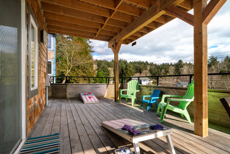Lower deck with outdoor lounging area, Corn hole boards and Adirondack chairs. Lower deck with outdoor lounging area, Corn hole boards and Adirondack chairs.