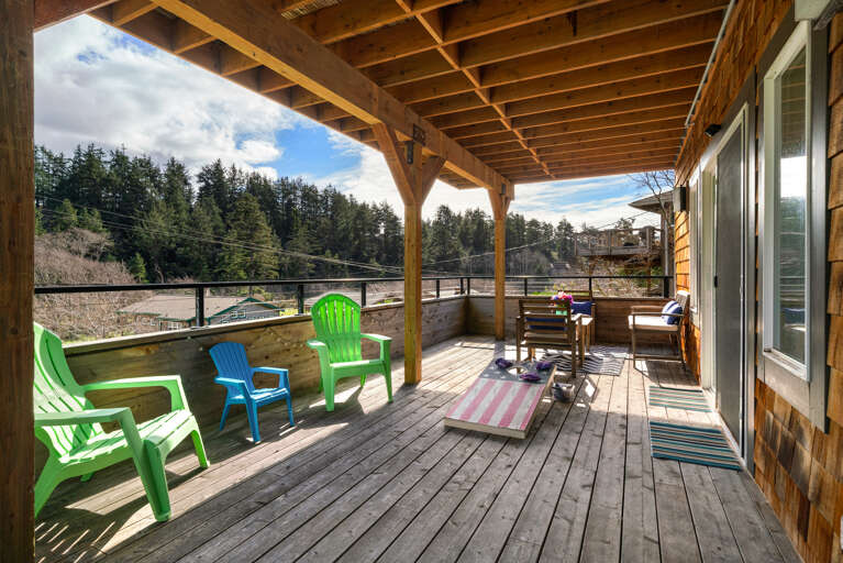 Lower deck with outdoor lounging area, Corn hole boards and Adirondack chairs. Lower deck with outdoor lounging area, Corn hole boards and Adirondack chairs.