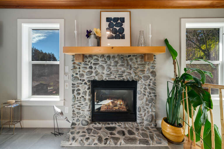 Open floor plan with Living room with Gas Fireplace, Streaming TV, Access to upper deck.  Open floor plan with Living room with Gas Fireplace, Streaming TV, Access to upper deck.