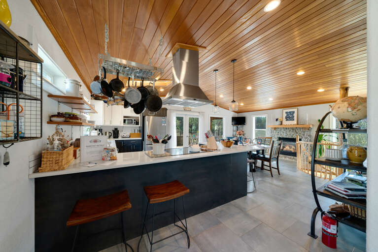 Open Floor plan with Fully equipped Kitchen, Dining table for 6 plus Bar seating. Open to the Living room with Streaming TV, Gas Fireplace, Access to upper deck.  Open Floor plan with Fully equipped Kitchen, Dining table for 6 plus Bar seating. Open to the Living room with Streaming TV, Gas Fireplace, Access to upper deck.