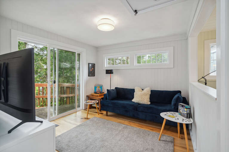 Second living space with streaming TV, Record player with albums, games, puzzles. Access to back deck. 