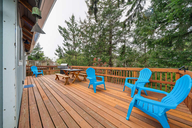 Back deck with picnic table. Perfect for puzzles, dominos etc. Adirondack chairs for lounging and gas BBQ for outdoor grilling. 