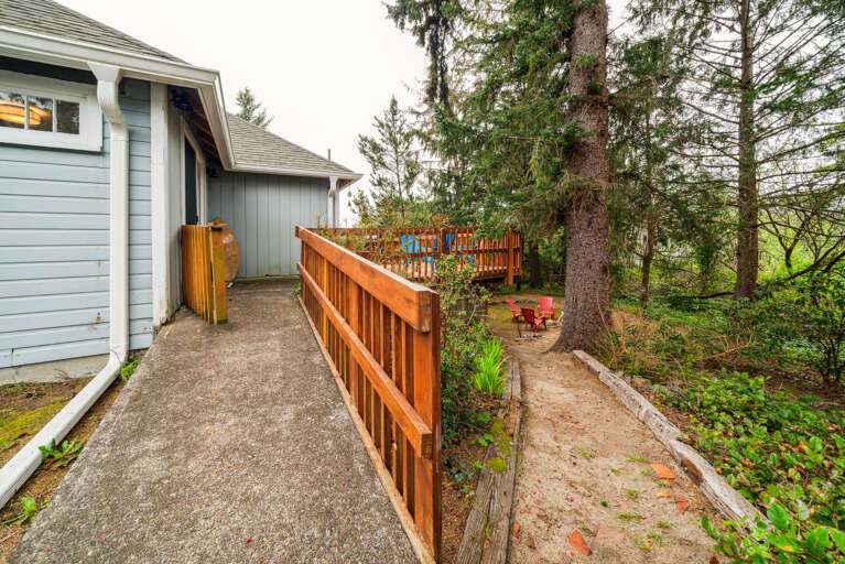 Back yard access from the second living space. Back yard has outdoor firepit. 