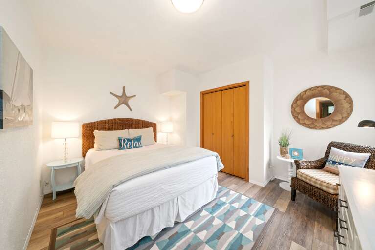 Downstairs queen bedroom with flat screen TV -Pack and Play in closet